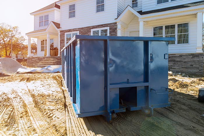 new-home-build-with-dumpster-for-material-waste